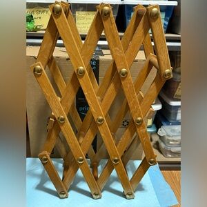 Vintage accordion-style wooden wine rack, constructed from oak with brass rivets